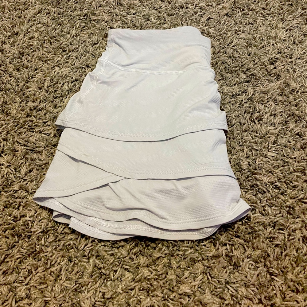 This is the Athleta white skort it has shorts and it has pockets